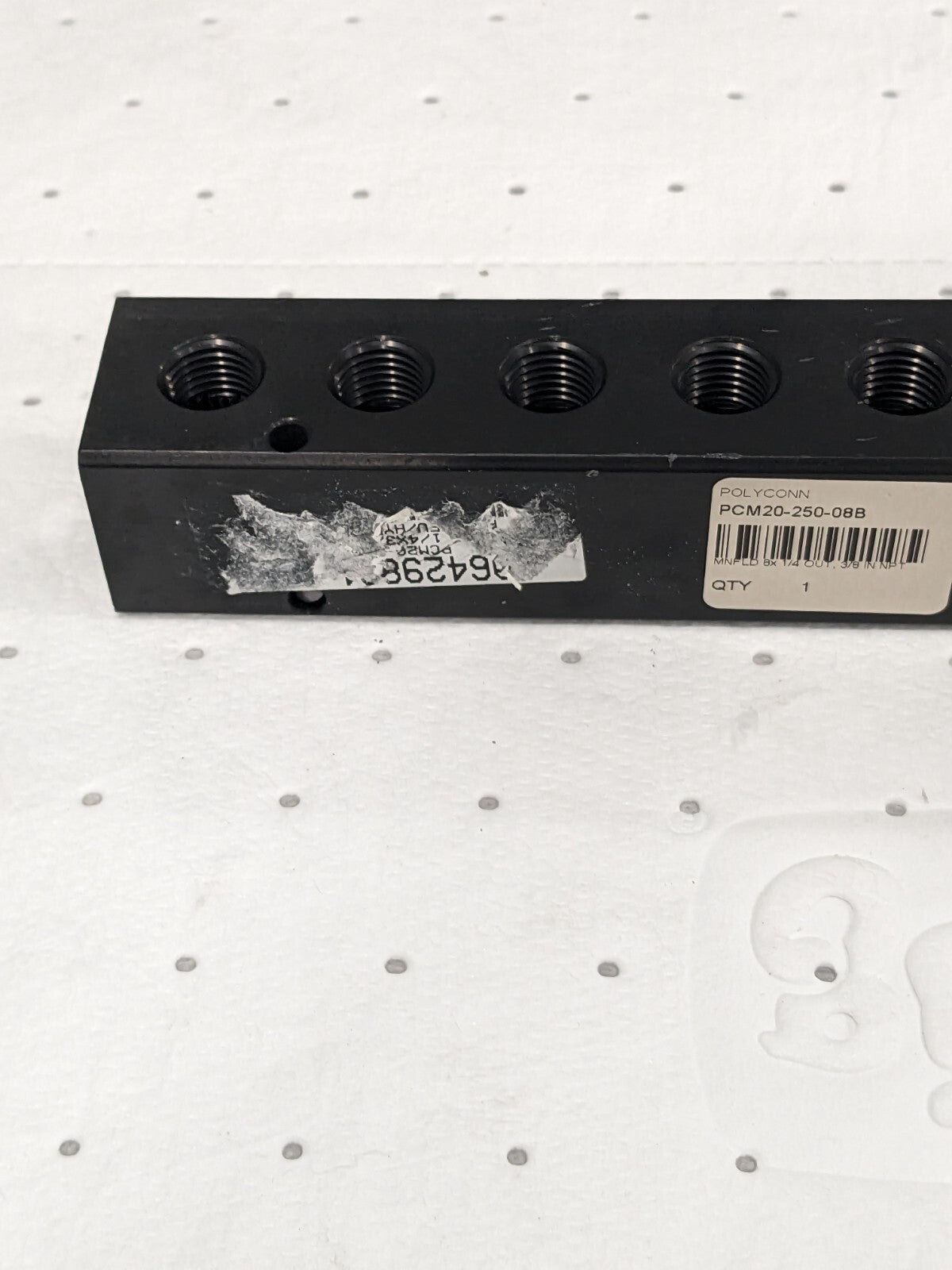 Manifold: 3/8" Inlet, 1/4" Outlet, 2 Inlet Ports, 8 Outlet Ports PCM20-250-08B