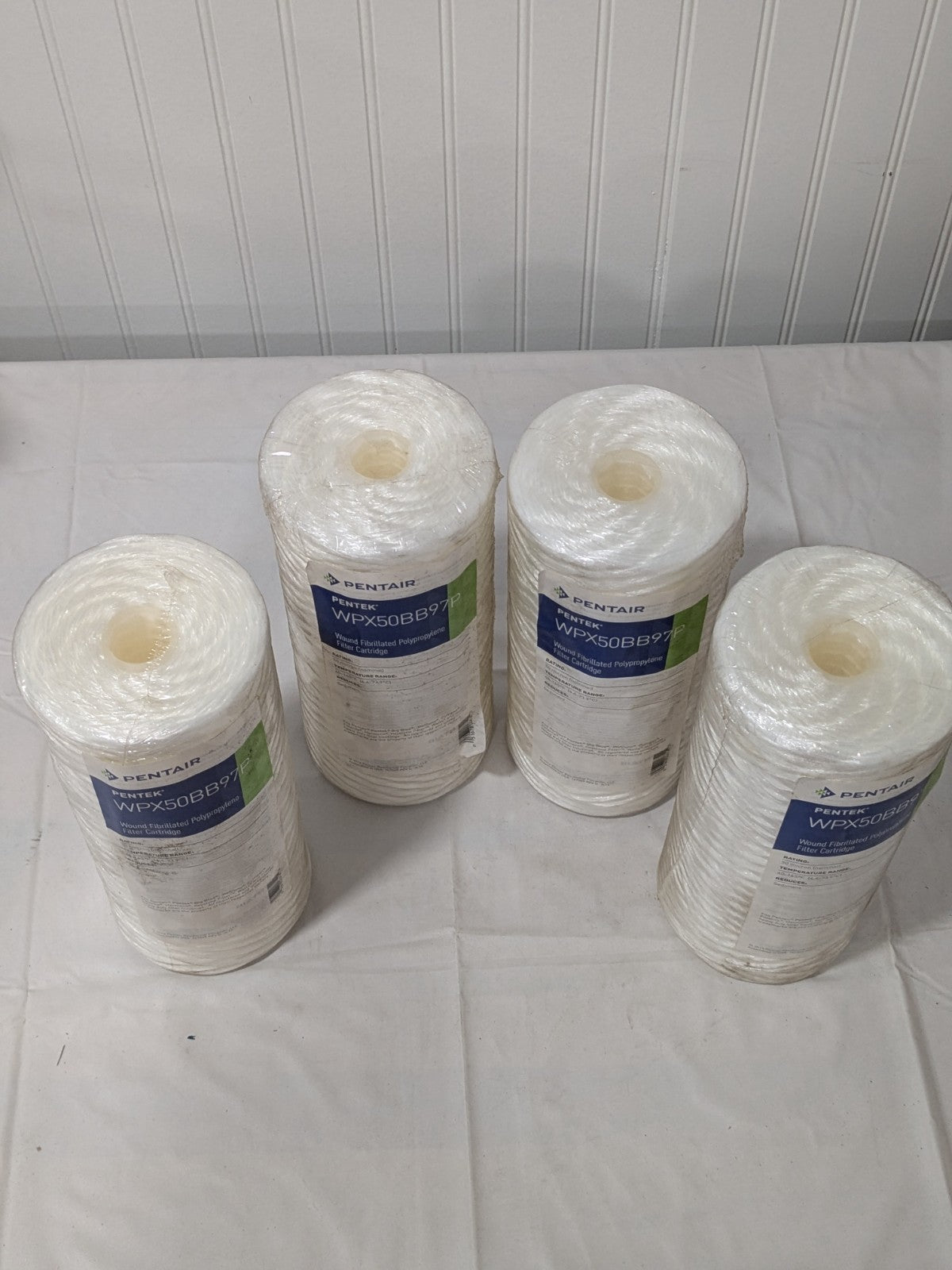 (4) Pentair Water Cartridge Filter: 4-1/2" OD, 9-7/8" L, 50 micron WPX50BB97P