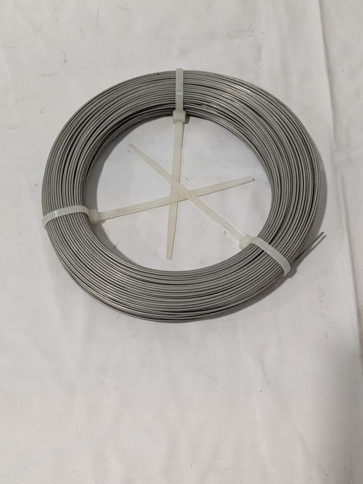 TBI Music Wire Coil: 302 & 304 Stainless Steel, 0.041" Dia, 223' Long M-SMW-41
