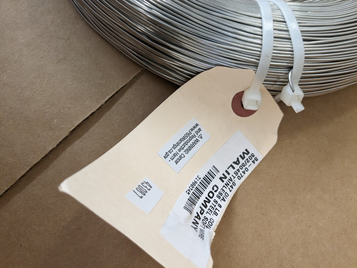 Spring Wire Coil: 302 Stainless Steel, 0.047″ Dia, 1,008' Long 32-0470-006C